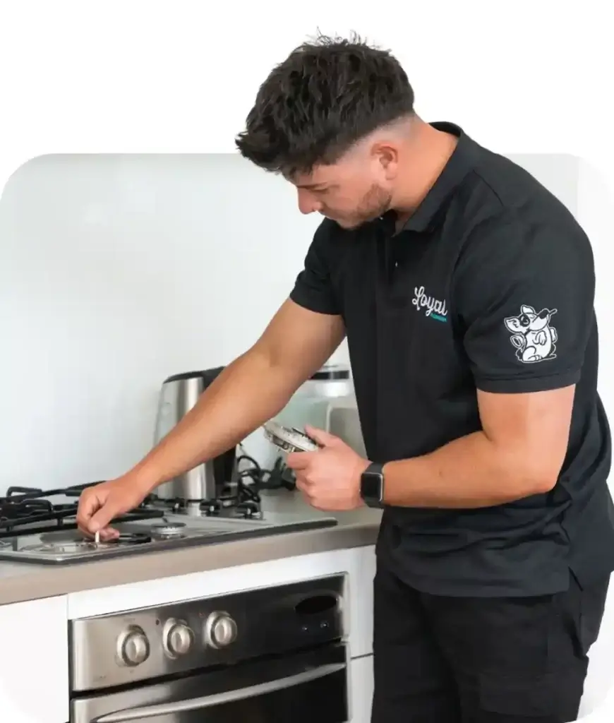 Loyal Plumbing gas fitter installing a cooktop
