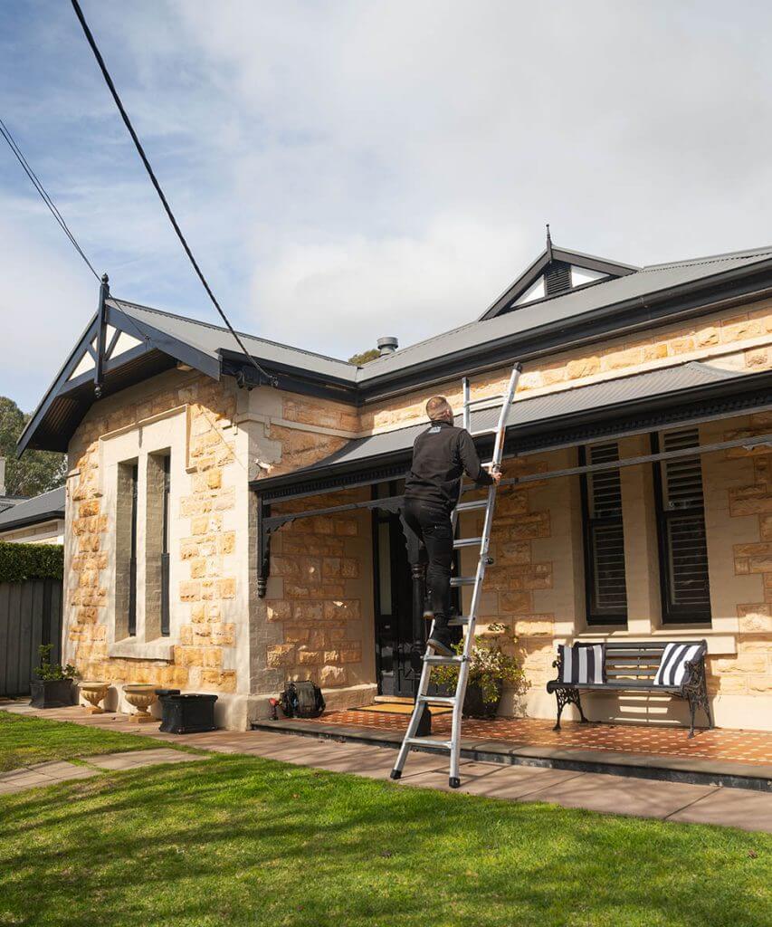 Plumber repairing leaking roof in Adelaide